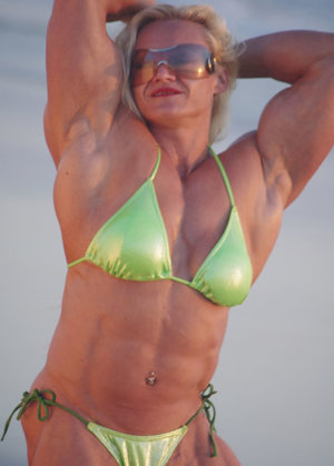 Blonde chick show off her big tits as she removes her string bikini